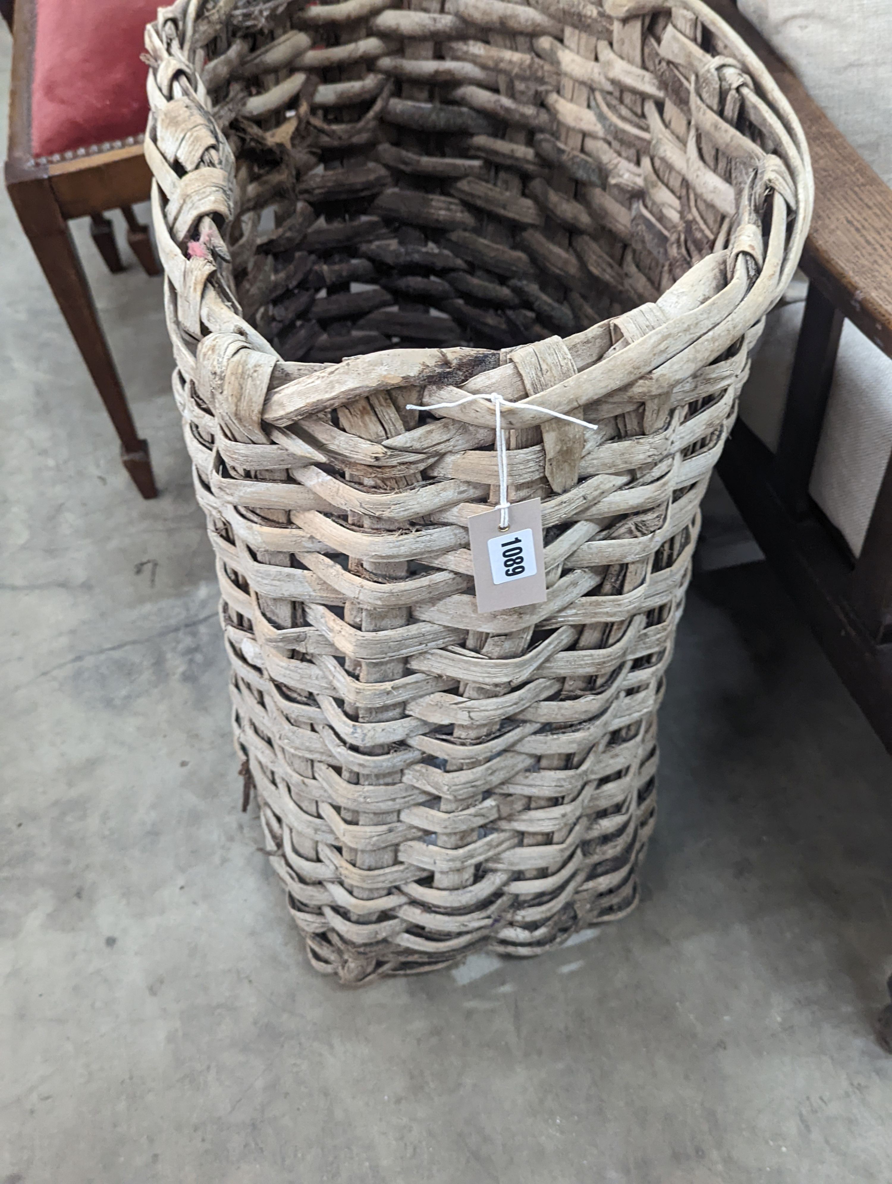 A vintage woven grape hod, width 48cm, height 64cm